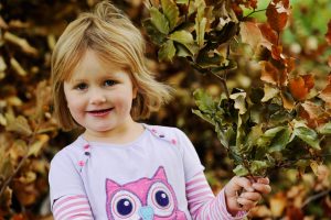 Pupil building a den in the garden