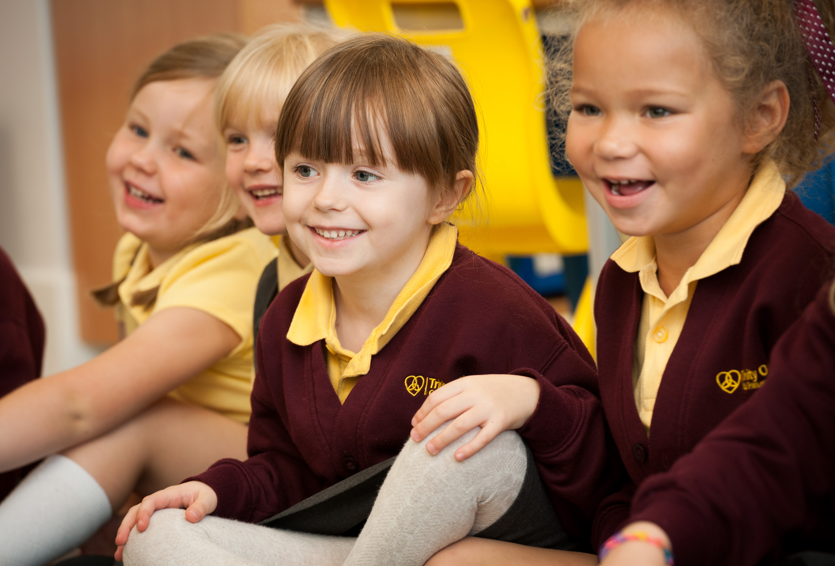 Children sitting on the floor in a school assembly