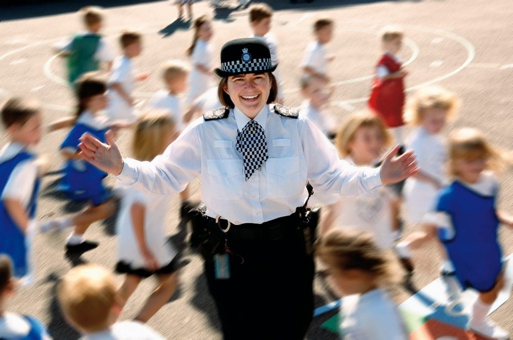 Police Officer with Surrey school children