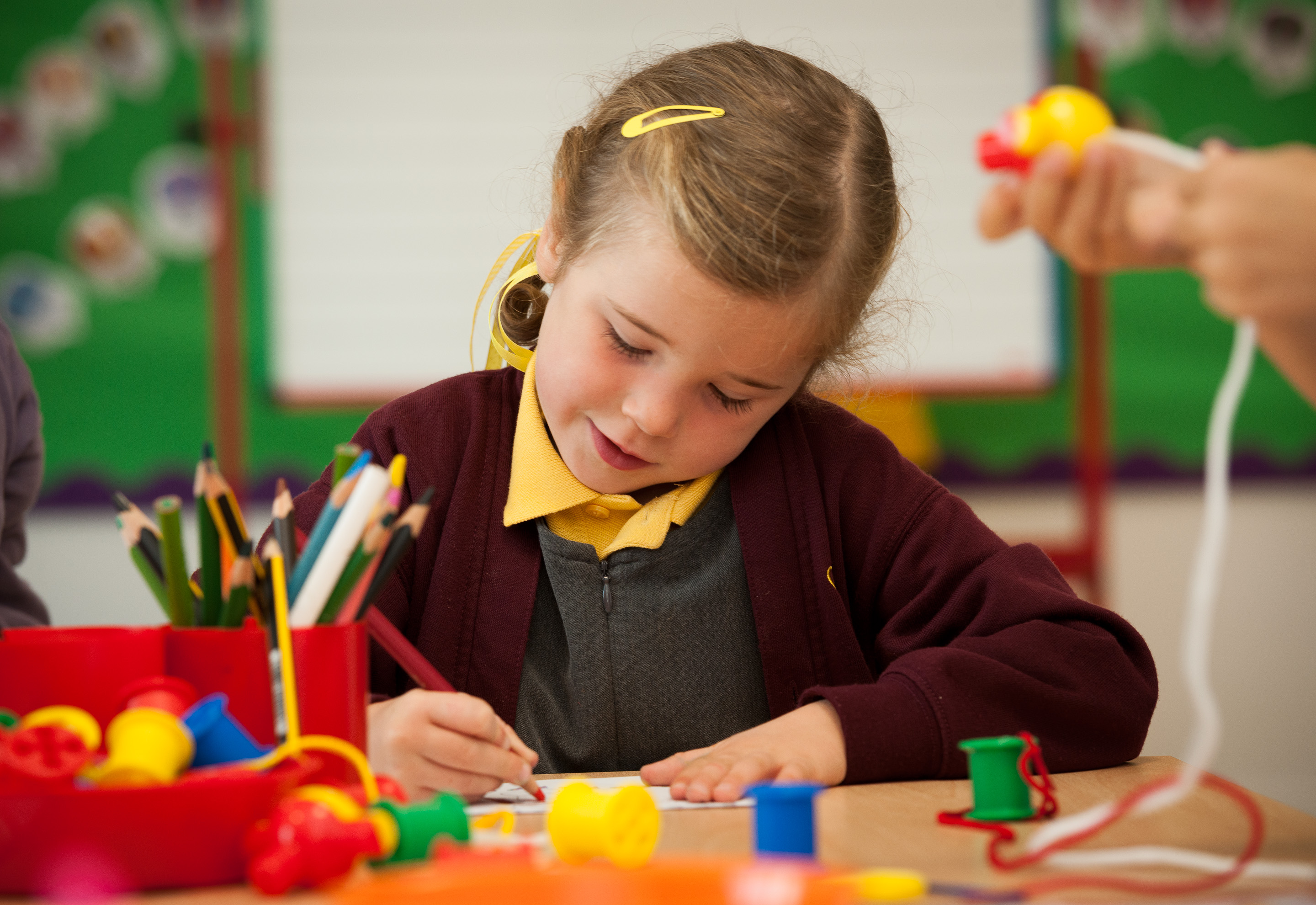 Pupil at in classroom drawing