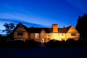 Night time shot of a wedding at Cain Manor, Farnham