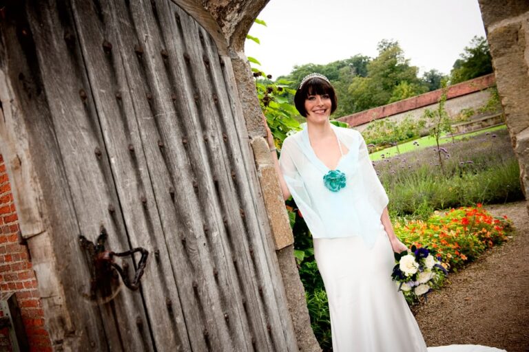 Bride in a walled garden doorway