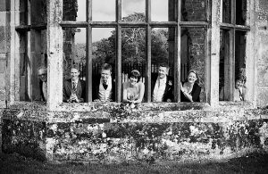 fun wedding group in the ruins, sussex wedding photography