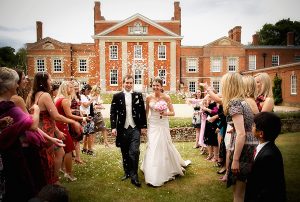 Shower of Confetti in front of Warbrook House, Eversley, wedding day