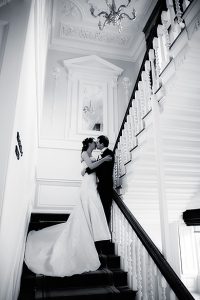 romantic wedding photogaphy on the stairs at Warbrook house