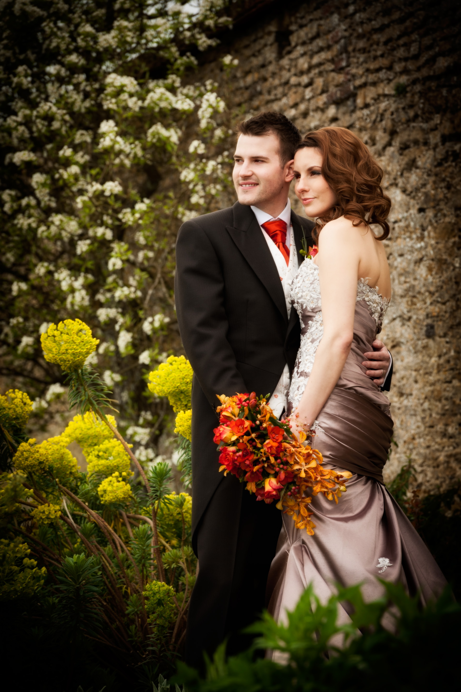 Bride and groom in the spring gardens at Loseley park, Guildford