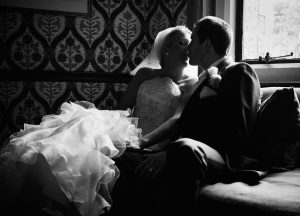 Silhouetted Newly Weds at Frimley Hall Hotel. Intimate moment between a bride and groom