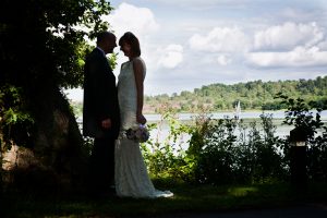 Silhouetted Bride and Groom at Frensham Pond