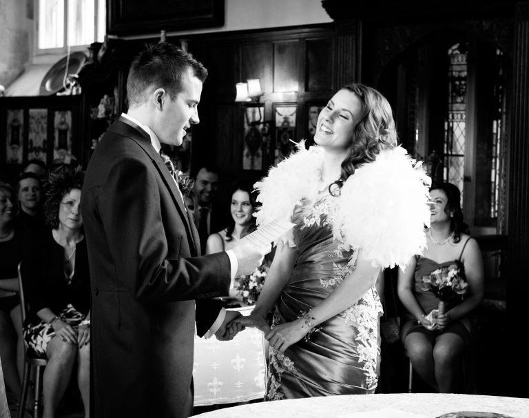 Laughter duing the wedding vows at Loseley Park