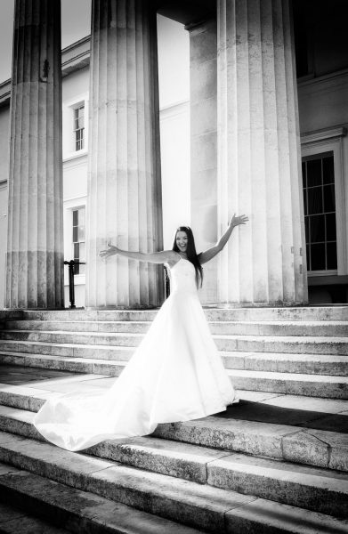 Fun bride on the steps of the Royal Military Academy Sandhurst