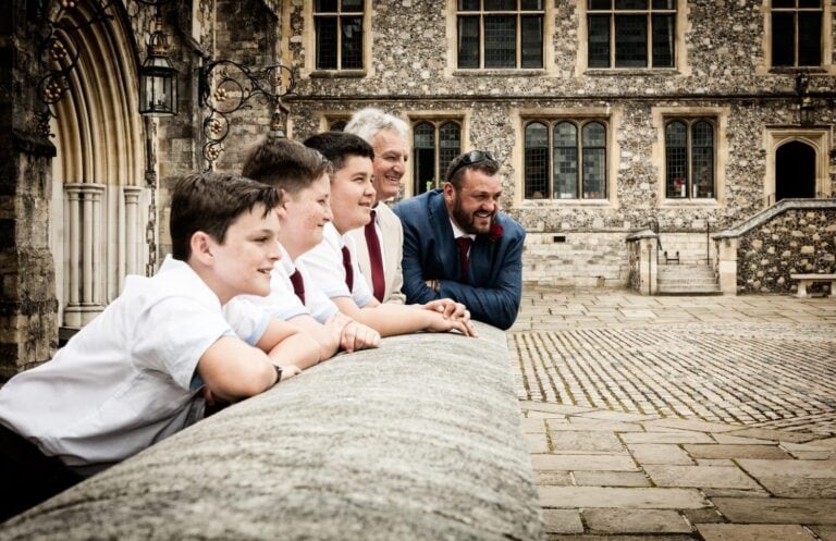 Boys looking over a wall