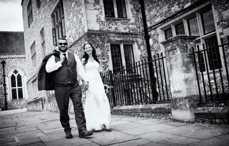 Bride and Groom walking through a town