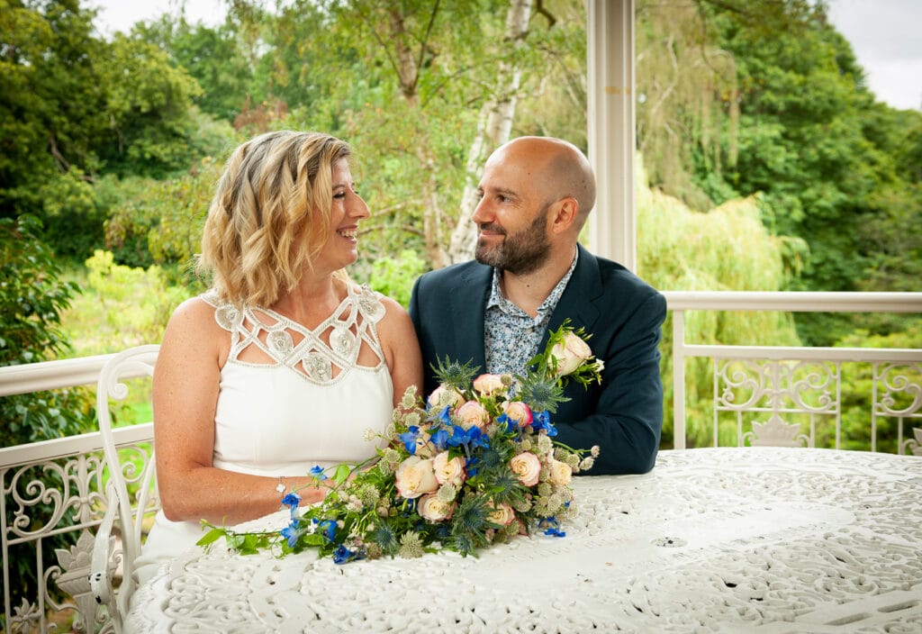 Bride and Groom Signing the register in a Bandstand