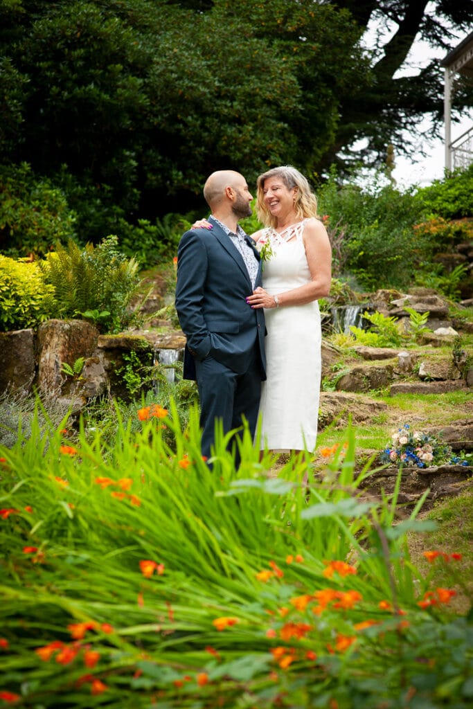 Bride and Groom in a rock garden at Pennyhill Park