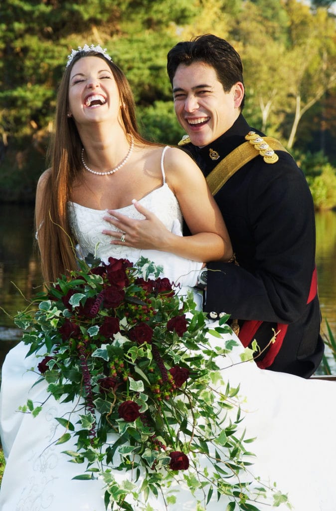 Army officer laughing with his bride