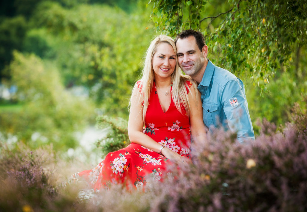 Couple sitting on Frensham Common among the heather