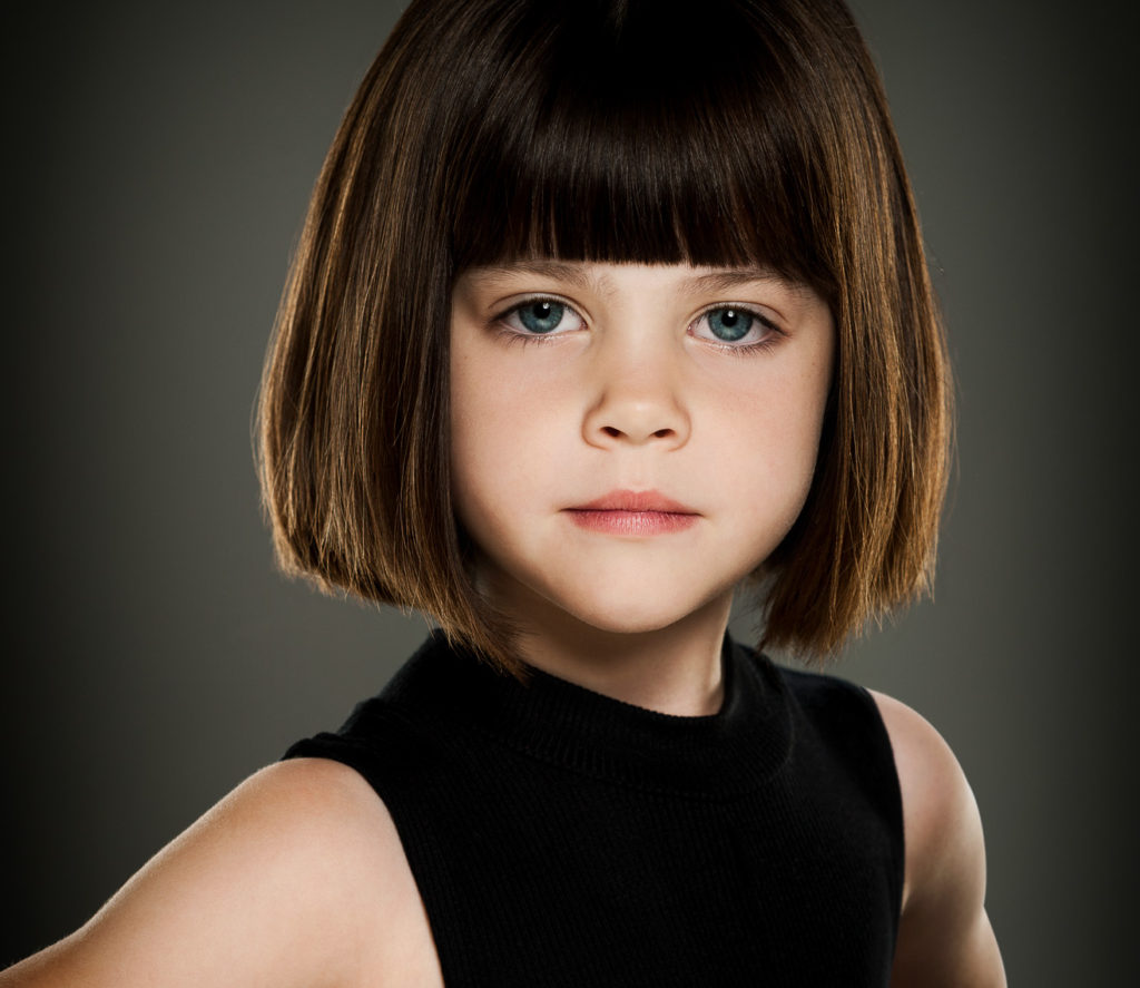 Stunning head and shoulder portrait of a young girl