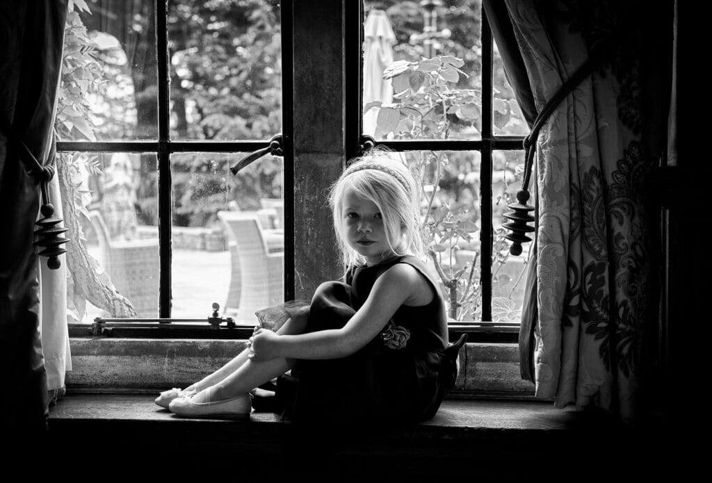 Flower Girl sitting on a window sill